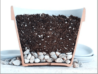 Rocks in the bottom of a planter pot