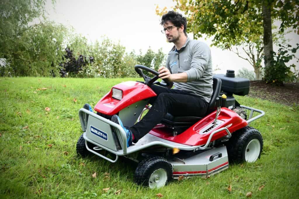 Riding lawn mower on uneven terrain
