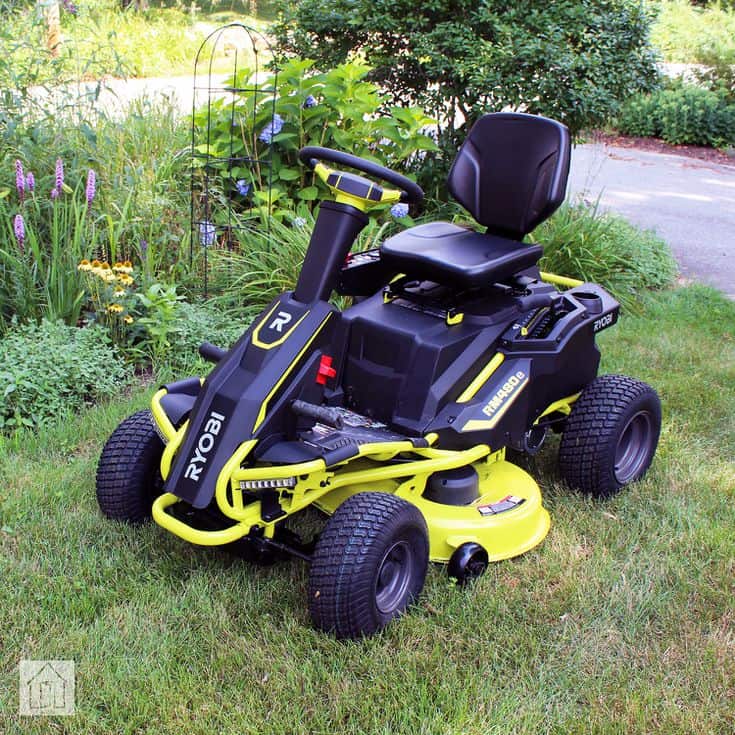 Ryobi lawn mower battery is on the parking