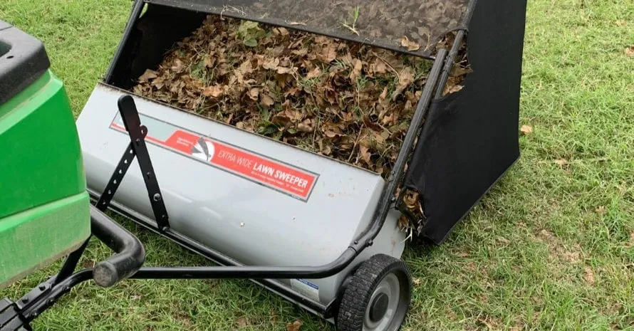 Using a grass sweeper