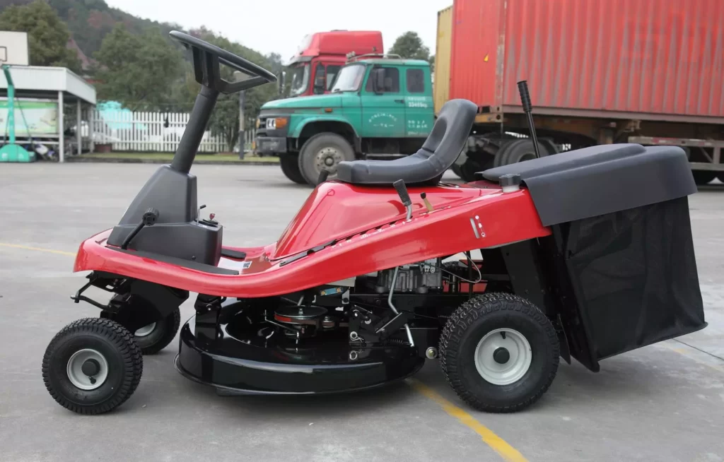 Small riding lawn mower with bagger